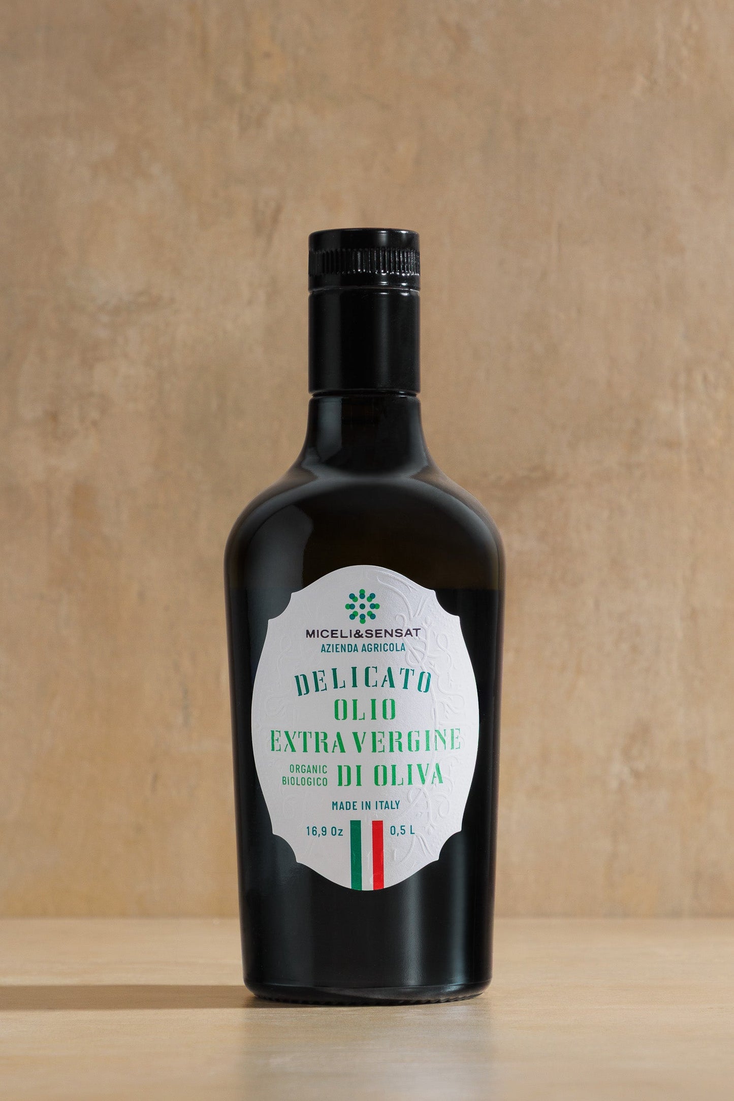 Delicato Organic Extra Virgin Olive Oil, dark glass bottle of organic Sicilian EVOO, Miceli & Sensat, Sicily